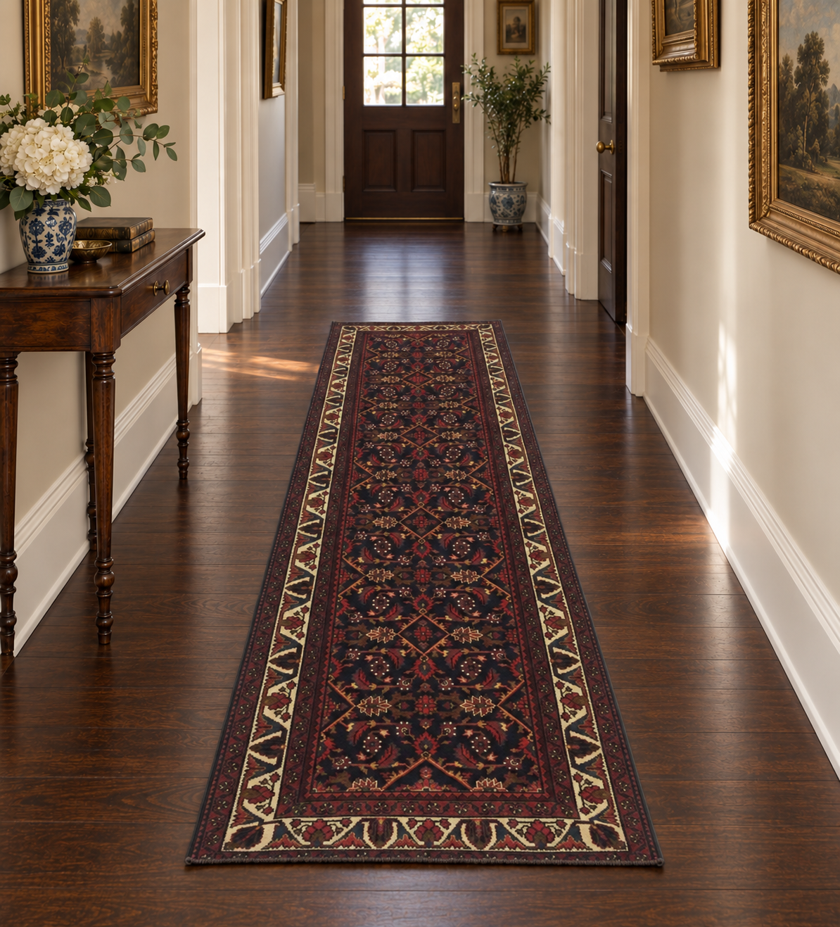 A traditional runner rug with a dark navy and red pattern and beige borders, displayed on a dark wood hallway floor.