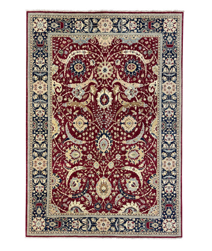 A traditional oriental-style area rug with an intricate floral and vine pattern, featuring a deep red central field, navy blue borders, and cream accents.