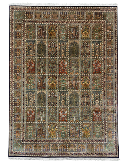 A rectangular traditional area rug with an intricate geometric and floral pattern, featuring a central field of arch motifs in muted earth tones and a decorative border, finished with white fringe on the top and bottom.