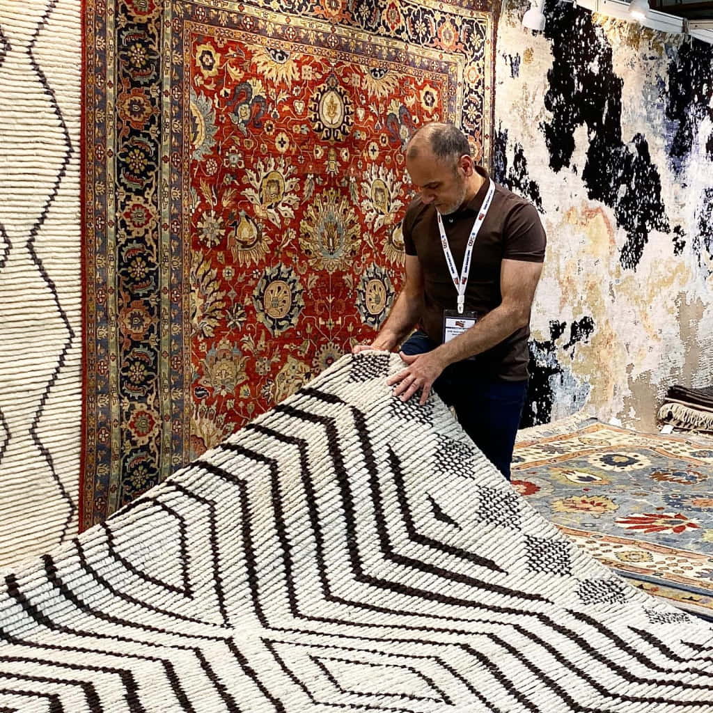 Majid checking quality of carpet